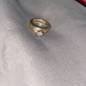 Size 4 gold engagement ring less than a year old 5 diamonds on it